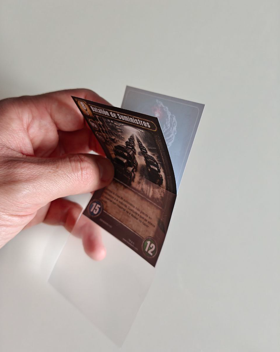 Game card partially pulled out of its sleeve, printed on A4 paper with front and back visible