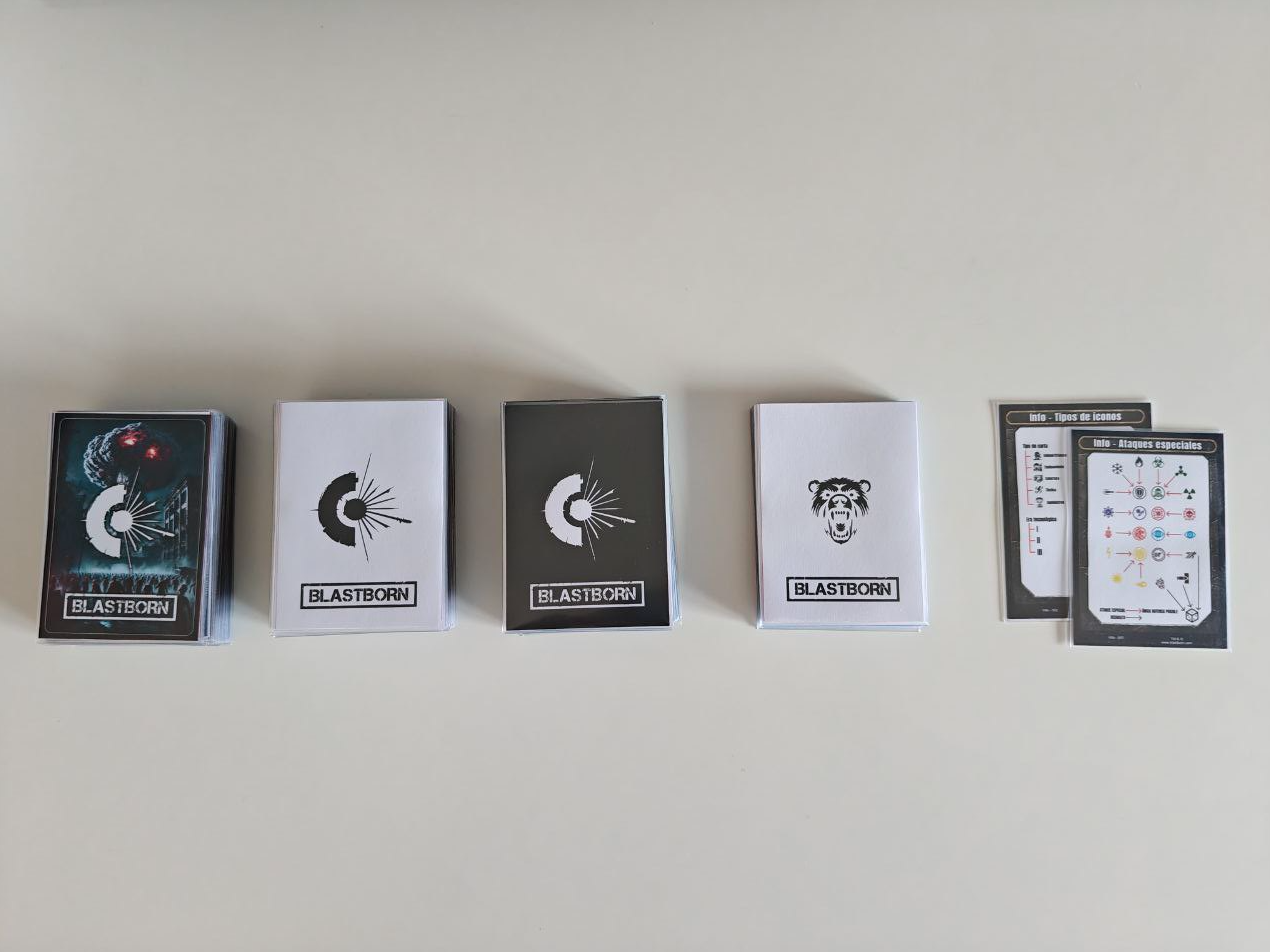 Initial decks of the game printed and placed face down showing the back with the logo